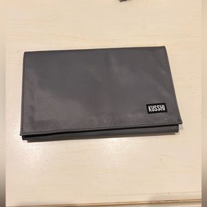 A KUSSHI brush holder - slightly used, but has a couple of light make up stains.